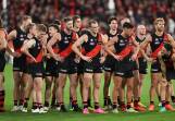 Essendon players can't hide their disappointment after the Anzac Day draw with Collingwood. (James Ross/AAP PHOTOS)