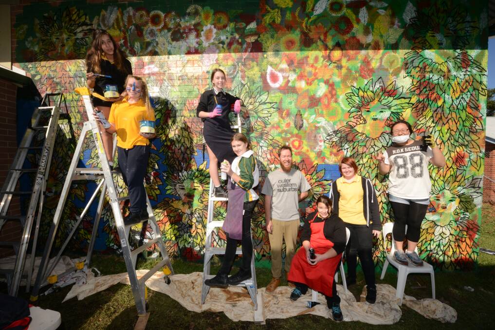 Celebrating youth culture:Indigenous and Chinese artist Jason Wing helped Taree High School visual art students create a new mural at Manning Regional Art Gallery.