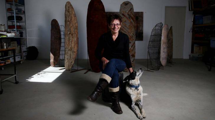 Artist and author Kim Mahood with her dog Pirate in her studio near Canberra. Photo: Andrew Meares