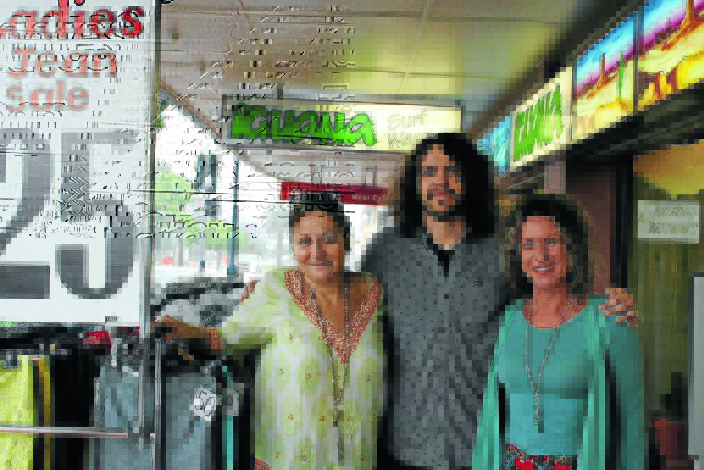 Jo-anne Yarad of Iguana Surf Wear and shoppers Paul Kelly and Vanessa Gibson