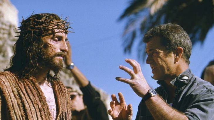 Cross to bear ... Jim Caviezel, who portrays Jesus, talks with Gibson on the set of The Passion of The Christ.
 Photo: HO