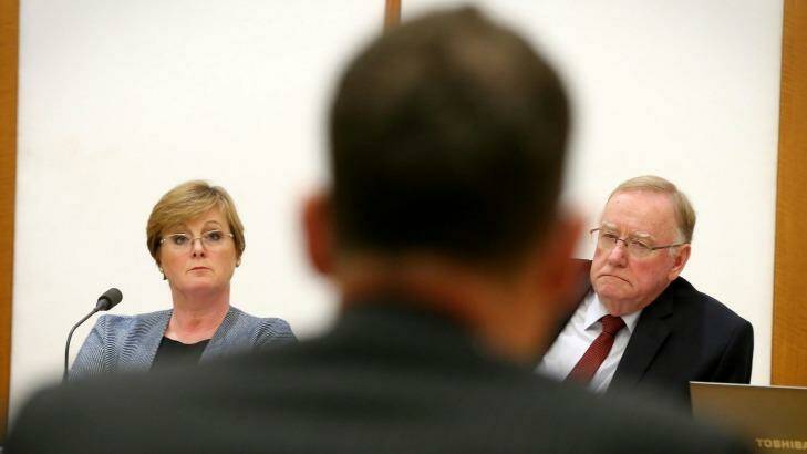 Senators Linda Reynolds and Ian Macdonald question outgoing Solicitor-General Justin Gleeson.  Photo: Alex Ellinghausen