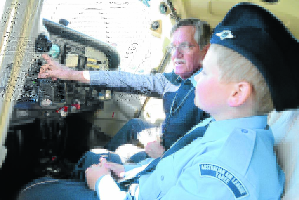 Flight instructor Mike Nolan teaches Tyrone Morgan the basics of the cabin.