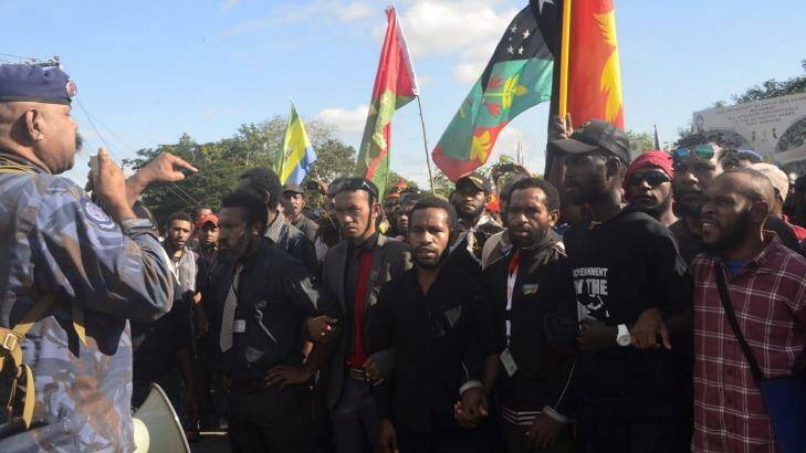 Student protesters in Papua New Guinea in a stand off with police. Photo: PNGFM News/Getty Images