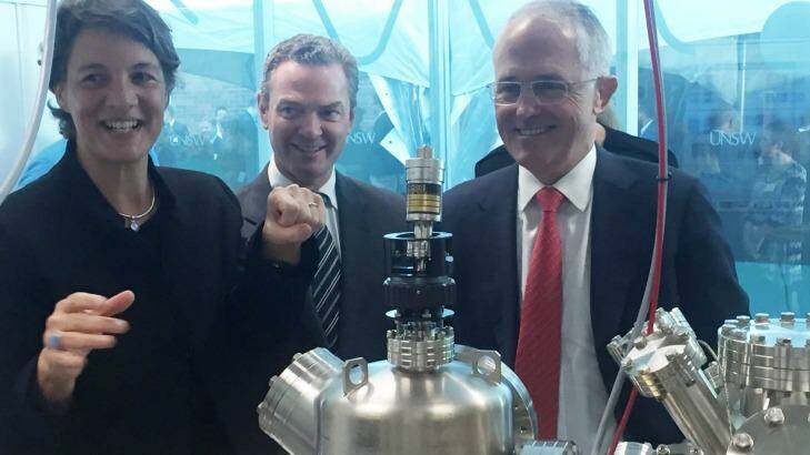 Professor Michelle Simmons explains the operation of a new scanning tunnelling microscope to Prime Minister Malcolm Turnbull and the then Minister for Science, Christopher Pyne. Photo: Marcus Strom