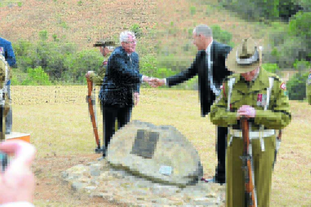 Mayors Paul Hogan and Peter Besseling unveil the memorial dedication plaque to Neville Howse VC.