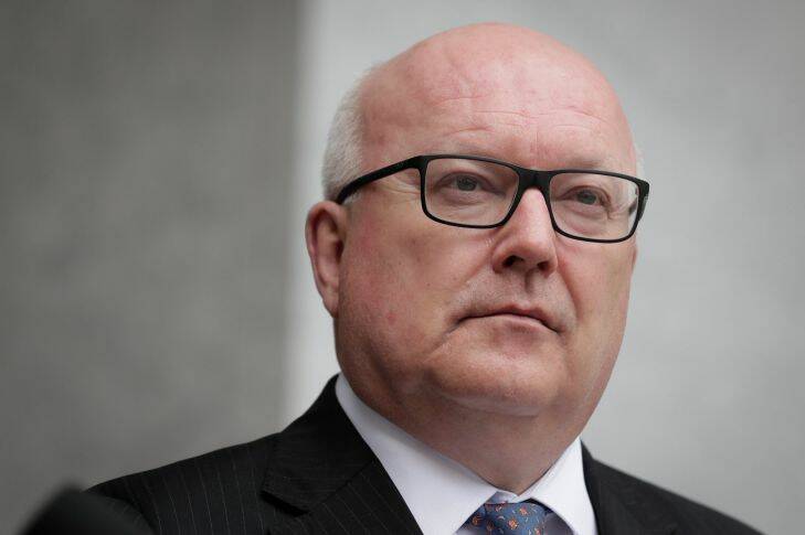 Attorney-General George Brandis addresses the media during a joint press conference at Parliament House in Canberra on  Tuesday 5 December 2017. fedpol Photo: Alex Ellinghausen