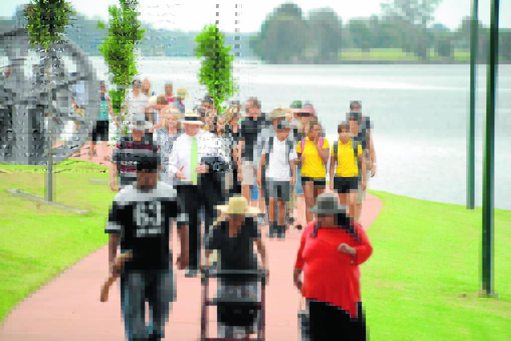 In the spirit of reconciliation: The crowd was invited to walk to Harry Bennett Park for morning tea.
