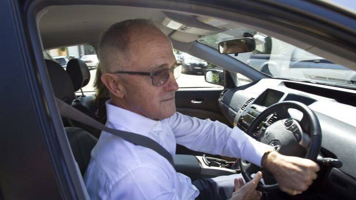 Communications Minister Malcolm Turnbull leaves his Sydney home on Friday. Photo: Louie Douvis