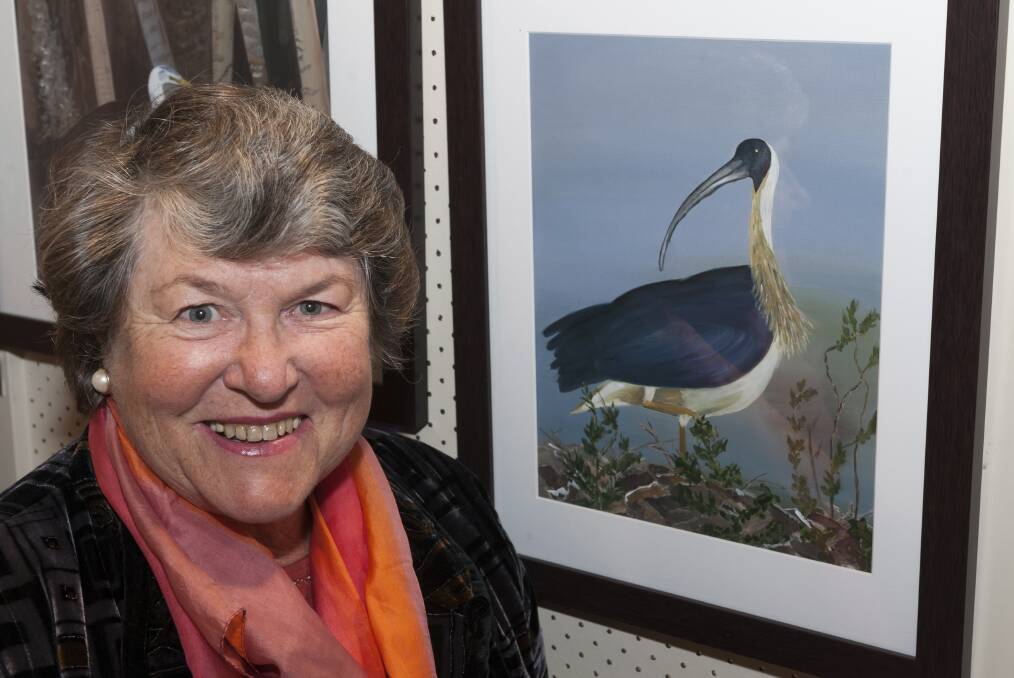 Helen Maybury with her work, Straw-necked Ibis, Kimberley.