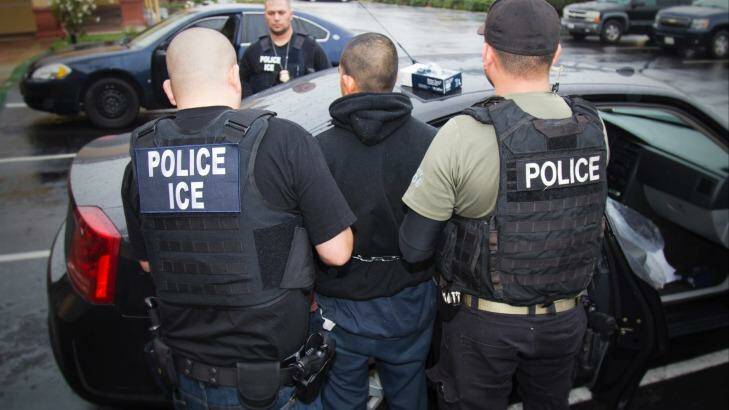 An arrest is made during a targeted enforcement operation conducted by U.S. Immigration and Customs Enforcement (ICE) aimed at immigration fugitives, re-entrants and at-large criminal aliens in Los Angeles.  Photo: Charles Reed/U.S. Immigration and Customs Enforcement via AP