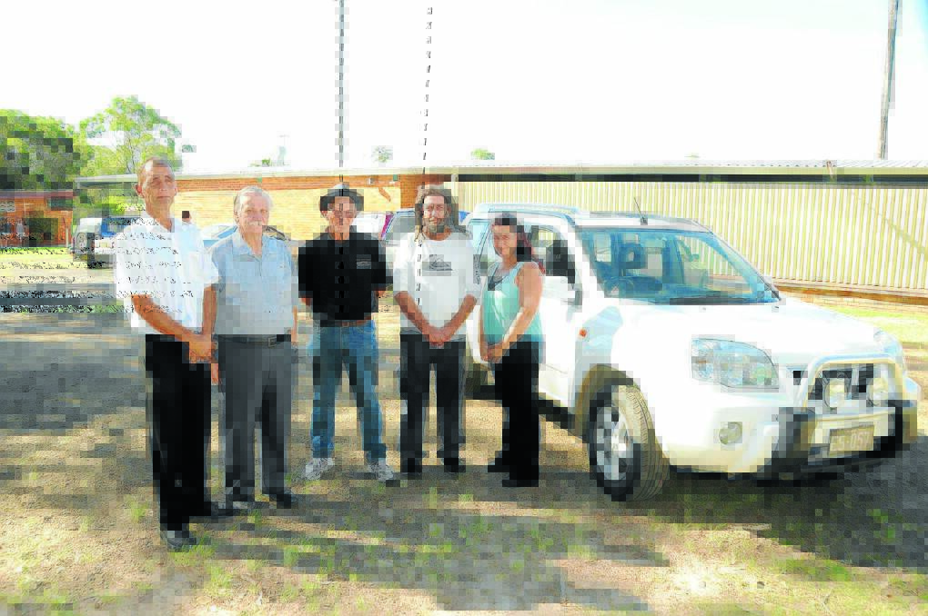 Taree Greyhound Club president Kerry Schmitzer, secretary Peter Daniel, committee member Len Absalom, trainer and accident victim, Dave Ward and Kempsey Greyhound Club president Vicky Burns with Dave's new car, purchased from the proceeds of fund raising by the greyhound community.