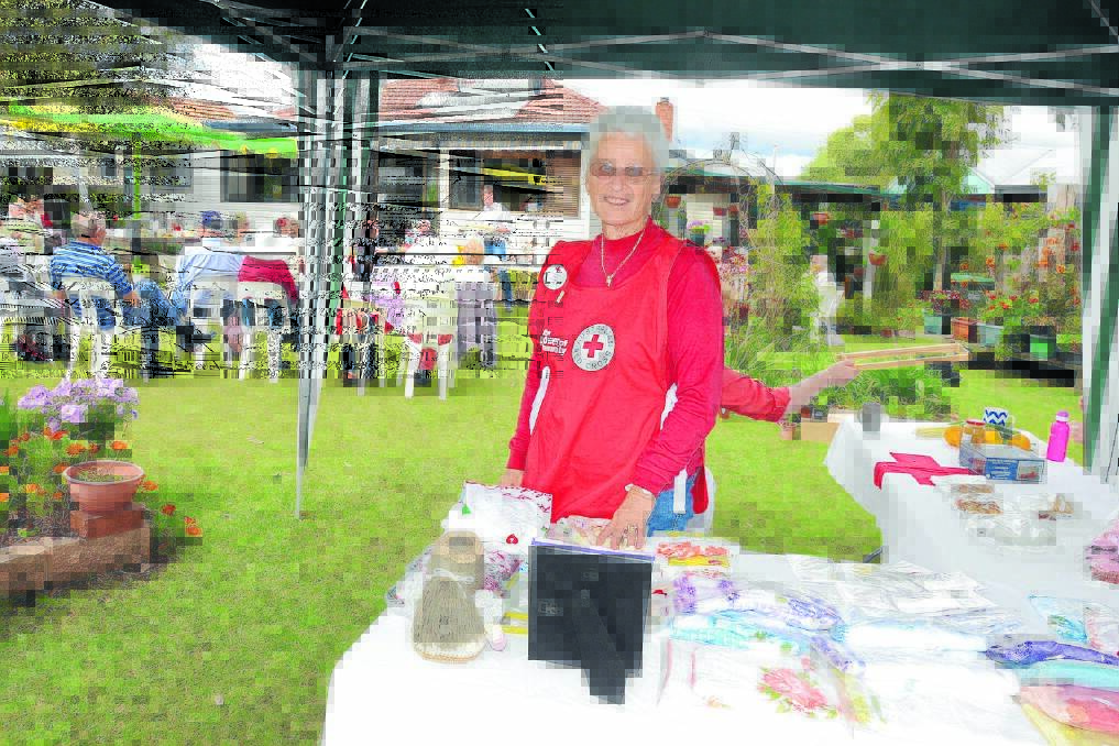 Spring fundraiser: Taree Red Cross Club publicity officer Libby Mather at the 2014 Taree Red Cross Club Garden Party.