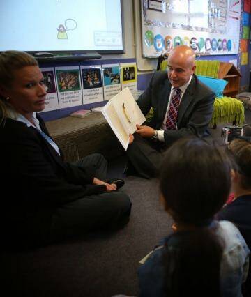 NSW Education Minister Adrian Piccoli poses with children at Condell Park Public School  Photo: James Alcock (Fairfax Media via Getty Images)