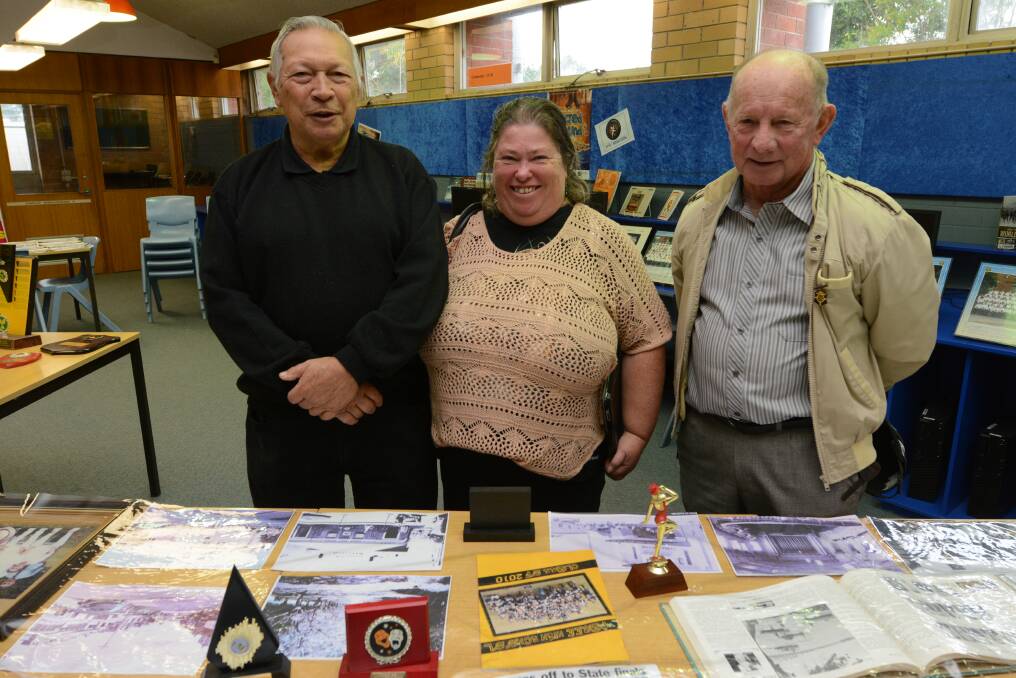 Maurie Griffin (Class of 57), Sandra Lin, and Bob Ezzy (class of 59) with some of the archives.