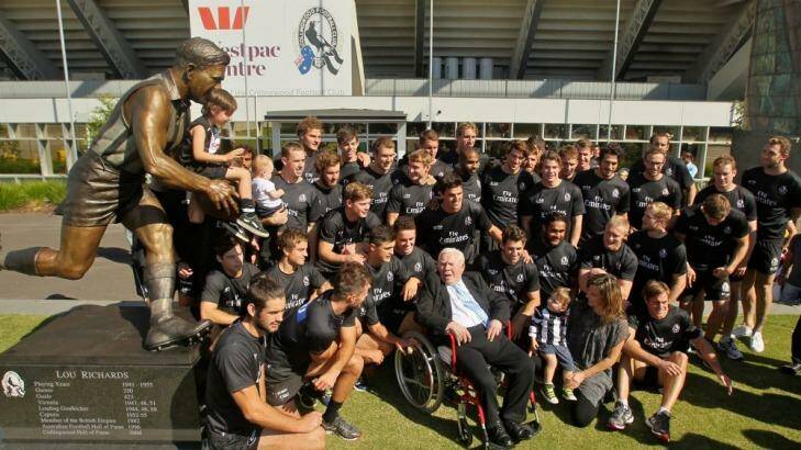 Centre of attention: Lou Richards surrounded by family and Collingwood players on Thursday. Photo: Ken Irwin