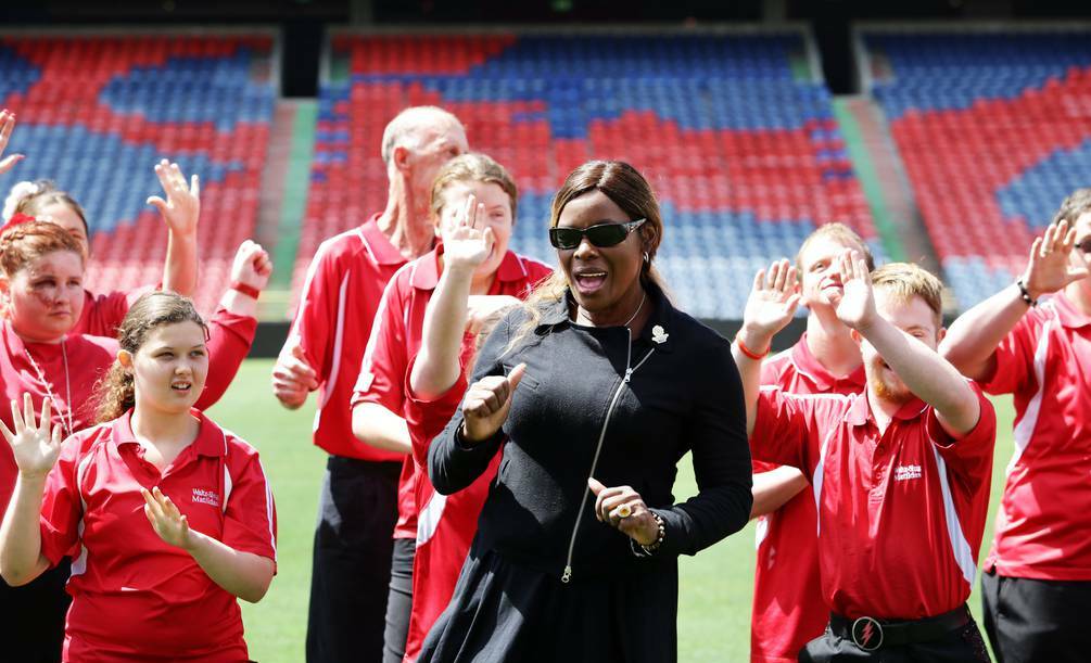 Marcia Hines and some of the 200-strong dancing troupe limber up for the opening ceremony with a dance at the stadium yesterday. Photo: RYAN OSLAND