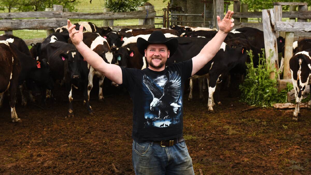 Farmer and singer Regan Tucker  singing to his cows hopes his music will help other farmers doing it tough. Picture: NEIL RICHARDSON