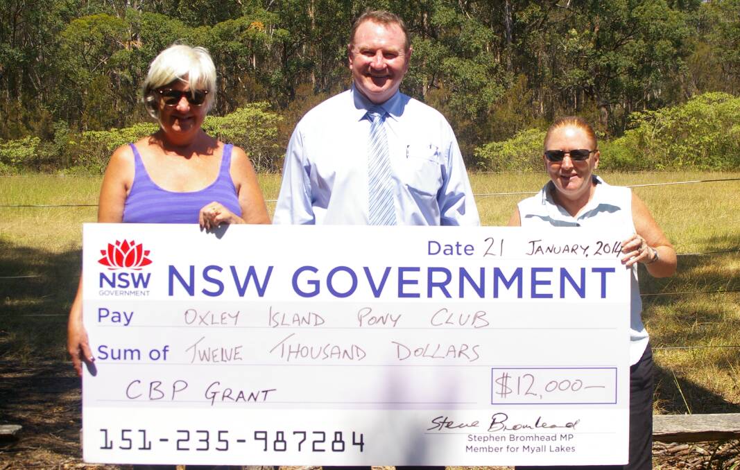 Member for Myall Lakes Stephen Bromhead (centre) presents a cheque to a delighted Oxley Island Pony Club president Ann-maree Swanson (left) and chief instructor Sharon Sowter.