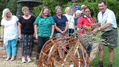 Members of the NSW Floral Art Association visit George Hoad's garden to discuss plans for their Land Art display.