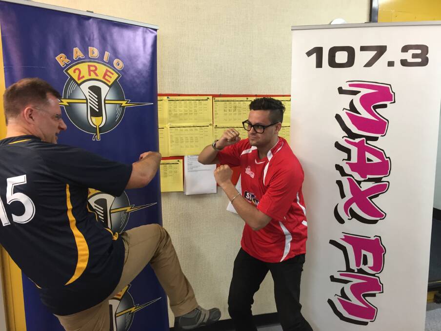 MAX FM and Radio 2RE's Anthony Zanos and Luis Zacher get physical before tomorrow's league tag challenge at the Jack Neal Oval. 