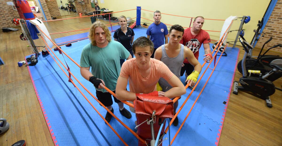 Boxers from left to right: Alex Right, Henry Woods, Ryan Spencer and Trent Watt. Taree PCYC Manager Tammy Homewood and trainer Peter Lewis stand in the background. 