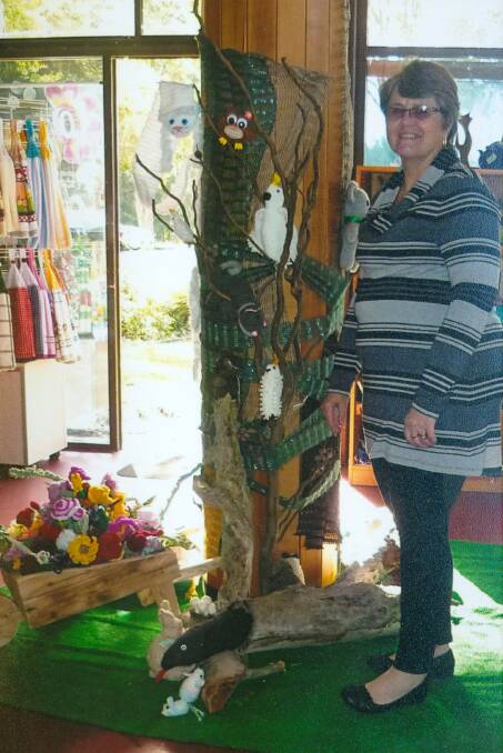 Anne Bloomfield with one of the displays at the Taree North craft shop.
