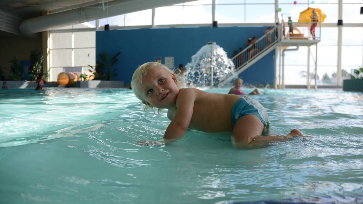 Safely swimming in the shallows of the wading pool was 16-month-old Mitchell Hyne at the YMCA Kids Fun Day. 