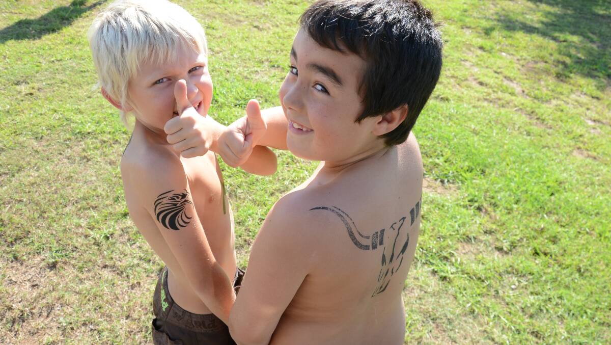 Sam Whittaker and Dean Franks got ink at the YMCA Kids Fun Day.