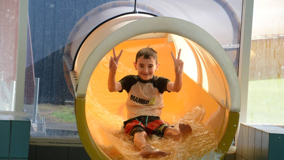 Aidan Williams was one of hundreds of kids to fly down the water slide at the YMCA Kids Fun Day.