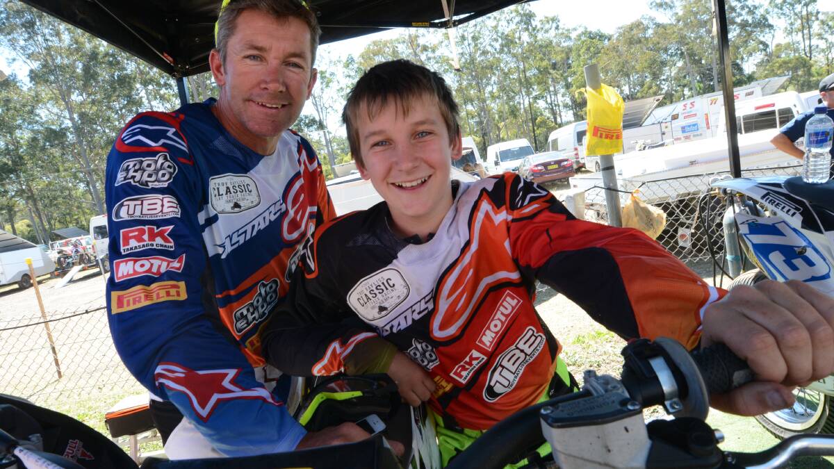 Troy Bayliss and his son, Ollie, at the Australian Senior Track Championship. Troy is expected to undergo surgery this week after breaking his collarbone and finger racing in the final of the pro 450.