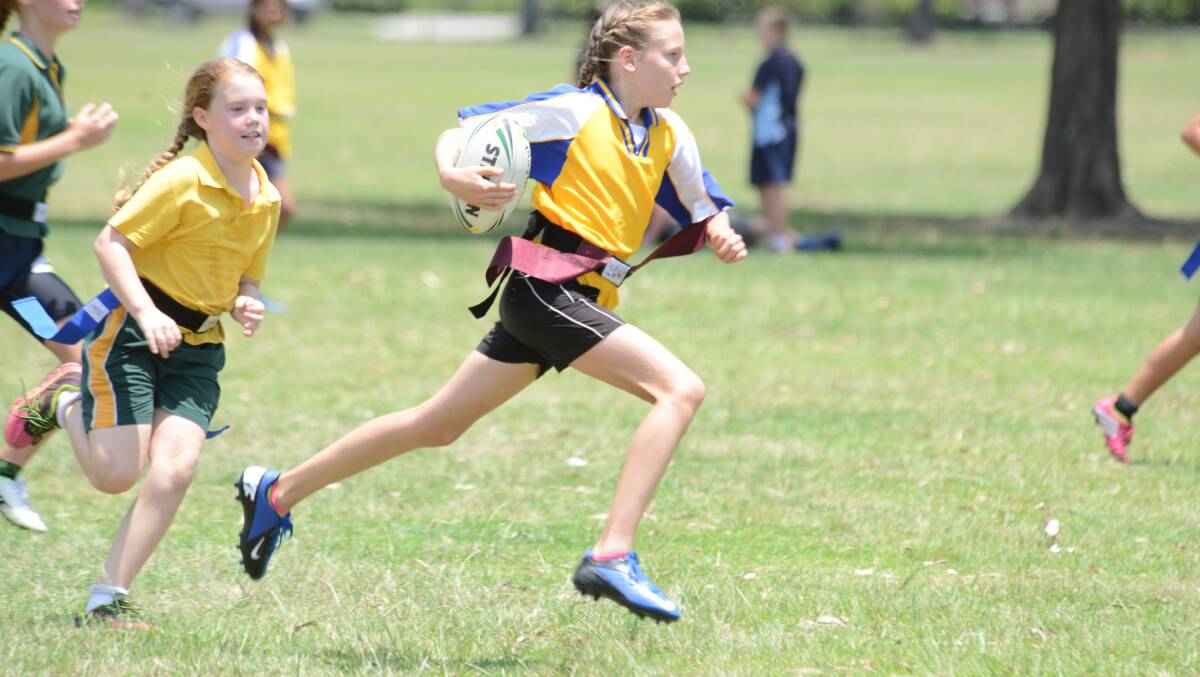 Samantha Chicken on the run in a match during the primary school league tag gala day played at Taree Recreation Centre.