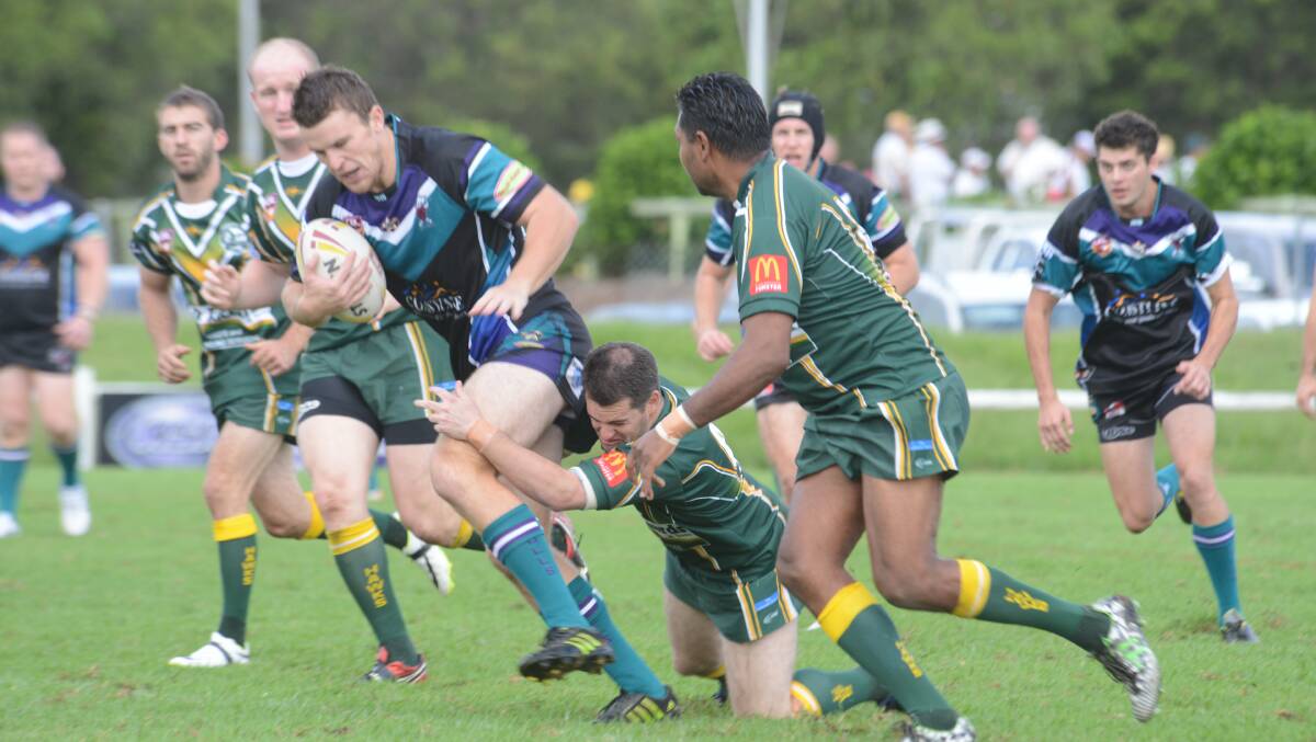 Taree City prop Will Clarke tries to break a Forster-Tuncurry tackle during the opening round Group Three Rugby League clash. Forster hosts Wauchope on Sunday in the second round while the Bulls have the bye.