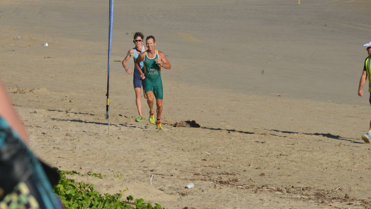 Tim Lang clears away from Sam Harris in the concluding stages of the Crowdy Head Triathlon to take line honours.
