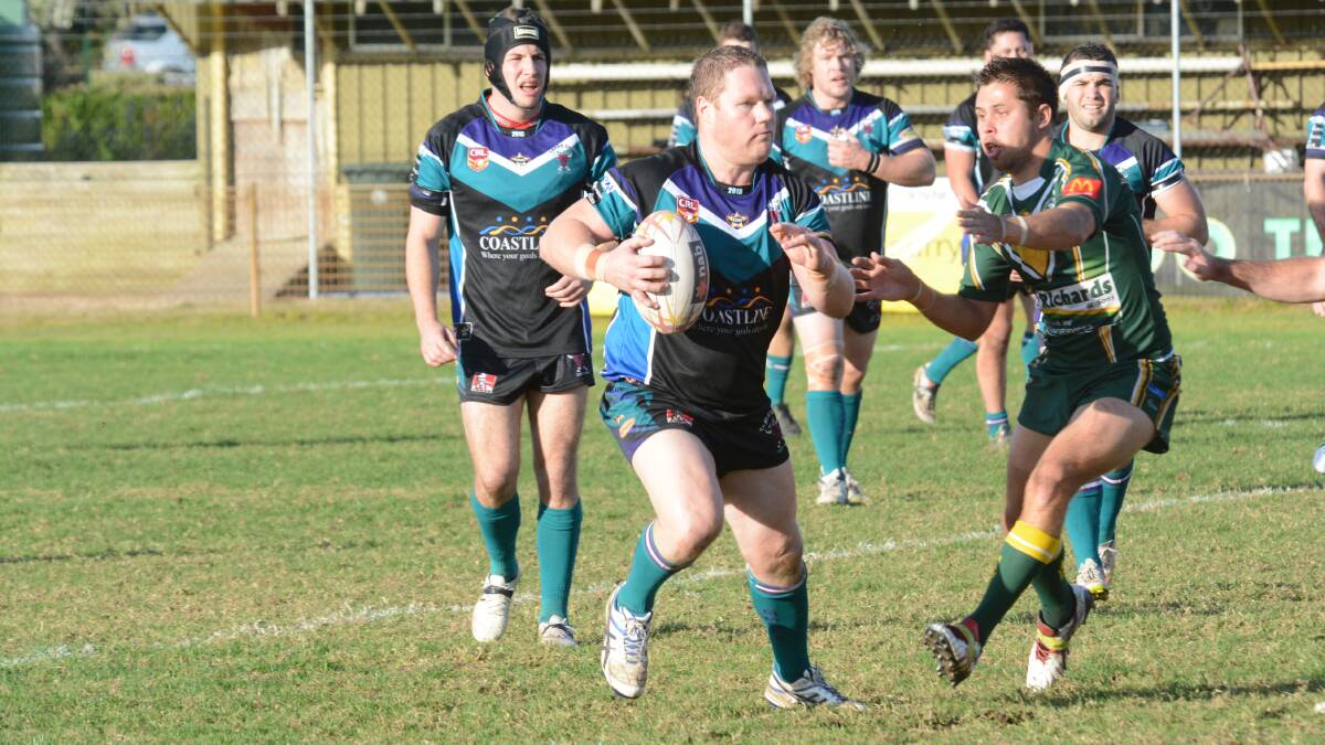 Taree City captain Ash Currey makes a charge during the Group Three Rugby League clash against Forster-Tuncurry at Tuncurry. The Bulls won 30-18.