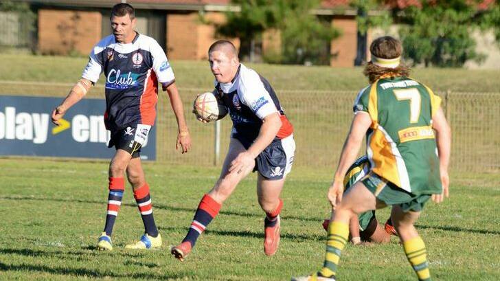 Old Bar captain-coach Danny Russell on the run in a clash last season against Forster-Tuncurry.