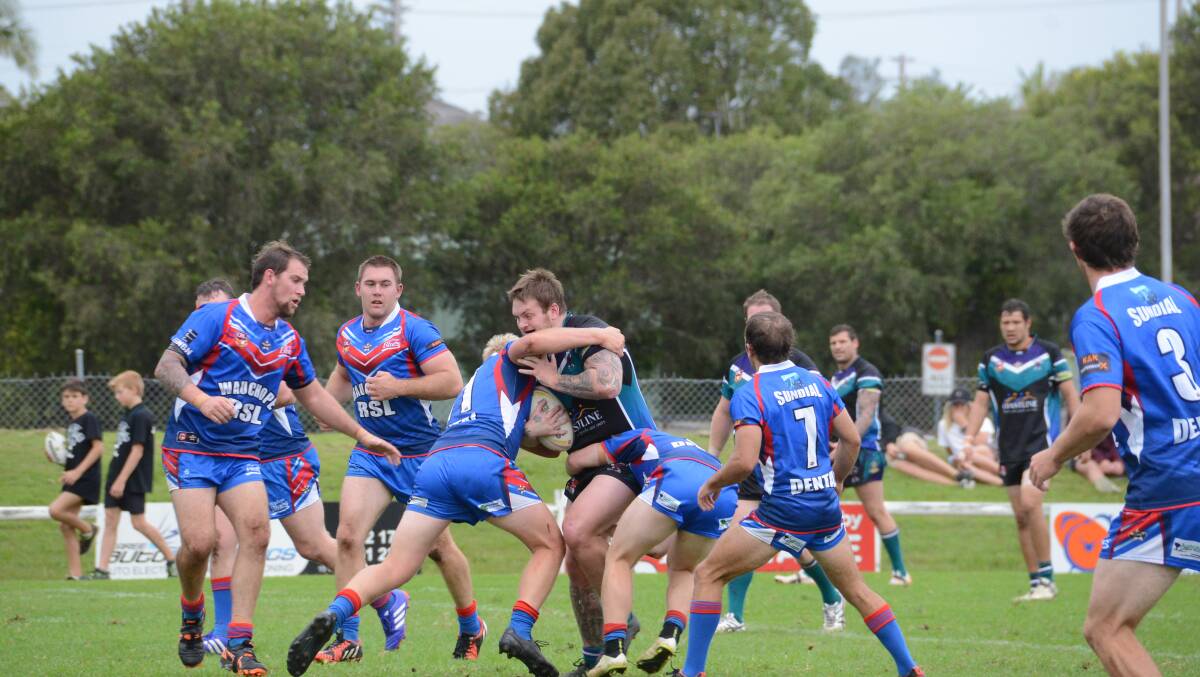 Wauchope defenders stop Taree City prop Josh Northam in the Group Three Rugby League game played at the Jack Neal Oval. Wauchope won the match 12-8.
