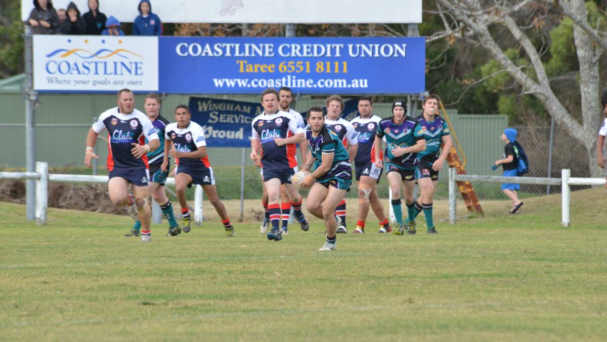 Taree City halfback Mick Henry looks to offload during a Group Three clash against Old Bar last season. Next year's pre-season looks set to kick off in March.