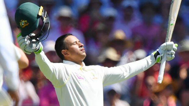 Man of the moment: Usman Khawaja takes in the feat of a century on his old home ground. Photo: AAP
