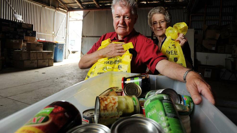 Wagga Vinnies regional president Trevor Urquhart (left) and volunteer Marie Ryan would like to see the community donate non-perishable items this weekend as part of The Leader Food Appeal. 