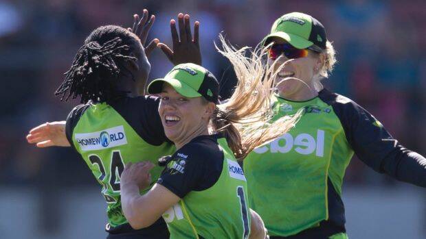 Positive start: Sydney Thunder celebrate their victory over the Renegades. Photo: AAP
