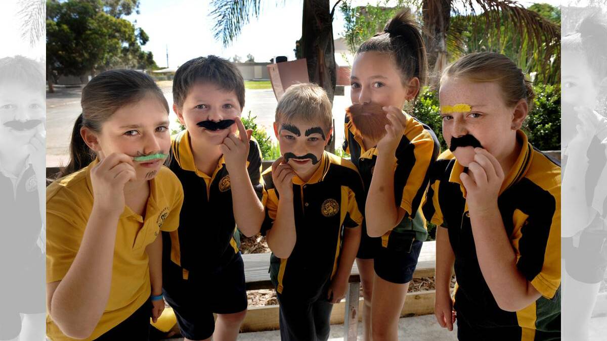 Horsham West Primary School students Kristen Smith, 10, Harvey Baker, 10, Mitchell Warrick, 9, Ella Slorach, 11, and Ally Janetzki, 11, get into the swing of men’s health campaign, Movember. Pictures SAMANTHA CAMARRI.