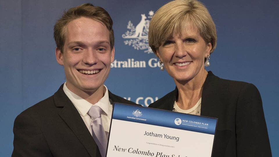 Former Taree High student, Jotham Young being presented his 'New Colombo Plan scholarship' by minister Julie Bishop.