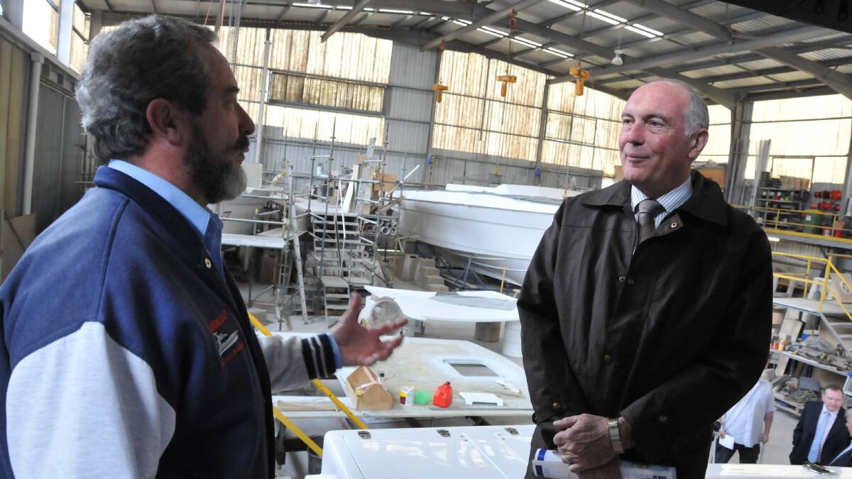 Warren Truss (right) speaking with Alan Steber of Steber International in July 2011. The now deputy prime minister and minister for infrastructure and regional development will visit in March.