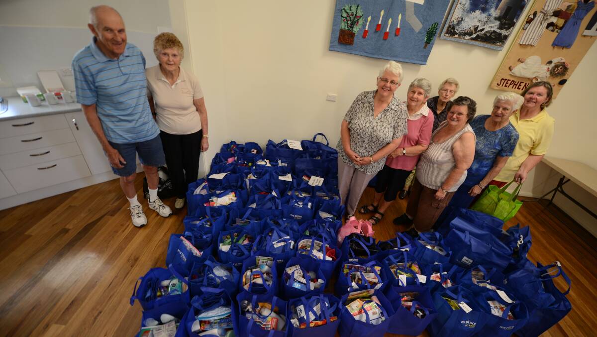 Chatham Uniting Church members, Bruce and Ruth Martin, Helen Russell, Bev Ferguson, Merle Richards, Jan Christie, Peta-Gai Adamson and Helen Walters prepare Christmas and pamper packs destined for the State’s west.