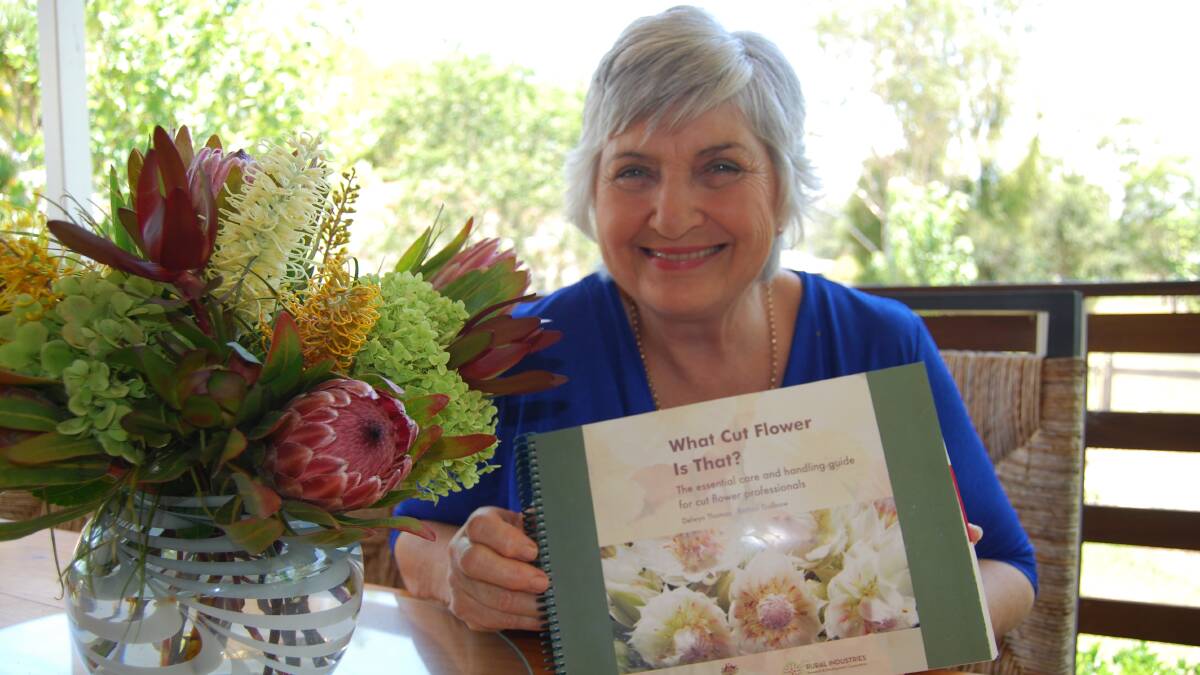 Del Thomas with the innovative floristry guide book she helped write.