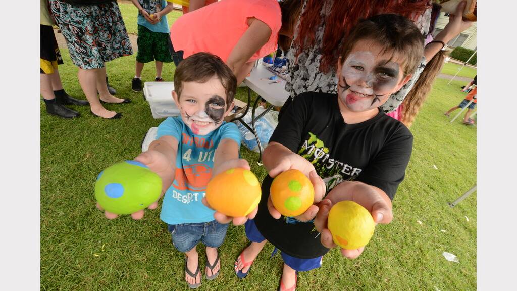 Alex Lewis and Fletcher Jobson dabbled in paint to create colourful eggs at the Mid North Coast Family Referral Service Family Fun Day in Taree.