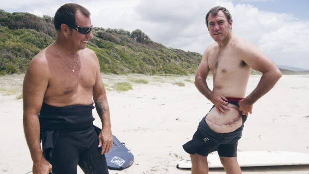 Dave Pearson (at left) with fellow shark attack survivor Dale Carr. Photo: James Brickwood
