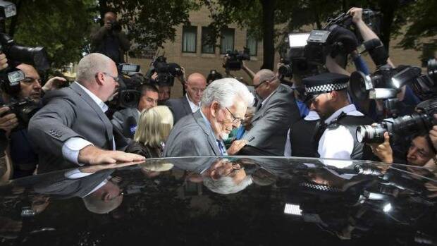 Guilty: Rolf Harris leaves the court after being found guilty of 12 counts of indecent assault. Photo: Reuters