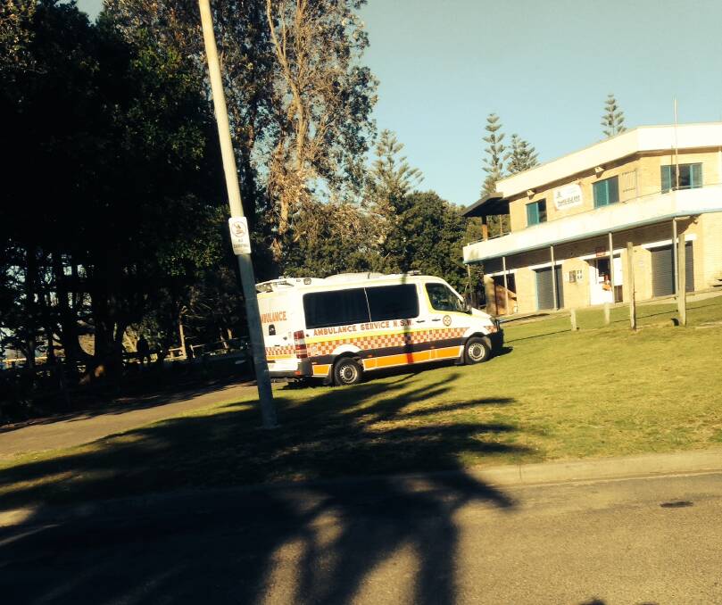 An ambulance on the scene at Old Bar beach this morning.